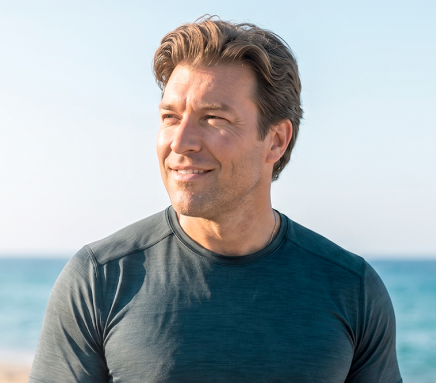Man at the beach representing provider-guided hormone wellness