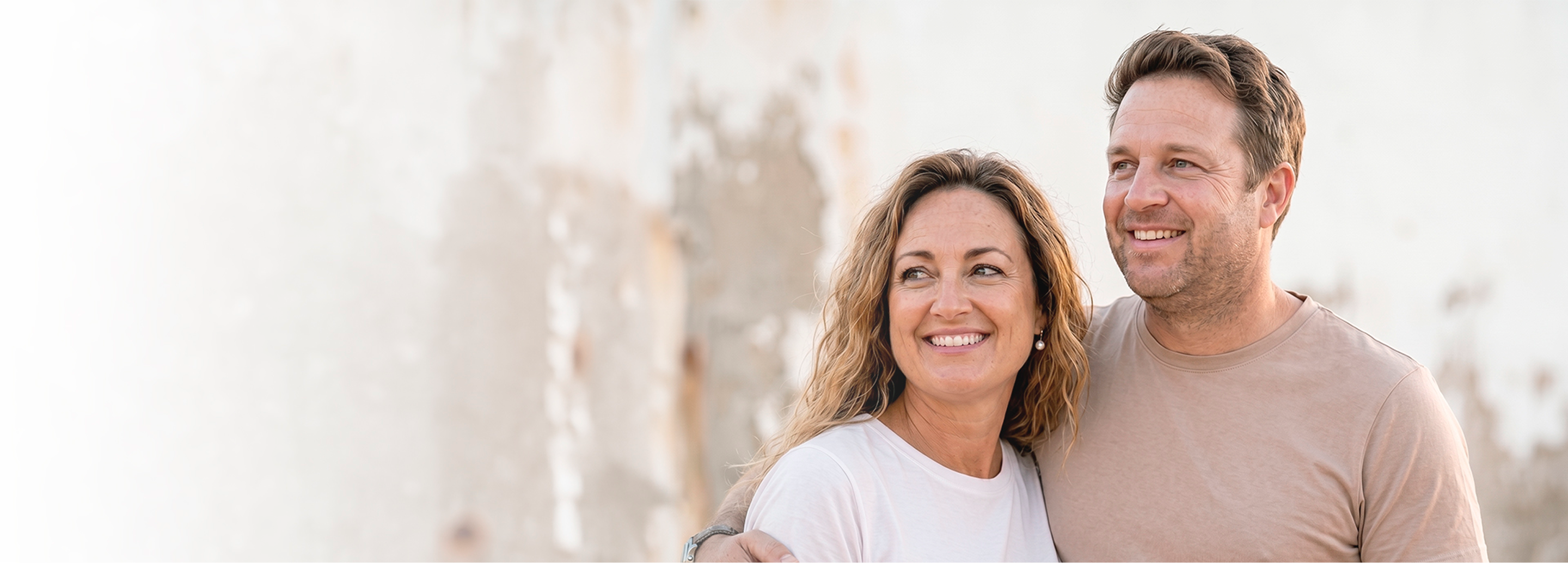 Couple smiling in a Nu Image weight loss and maintenance hero